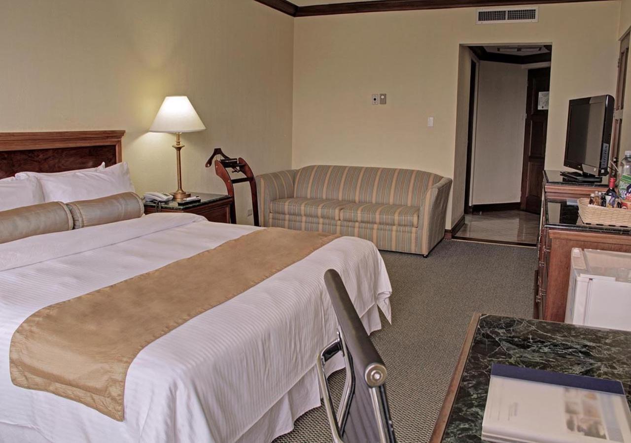 Wyndham San Jose Herradura Extérieur photo A room at the hotel
