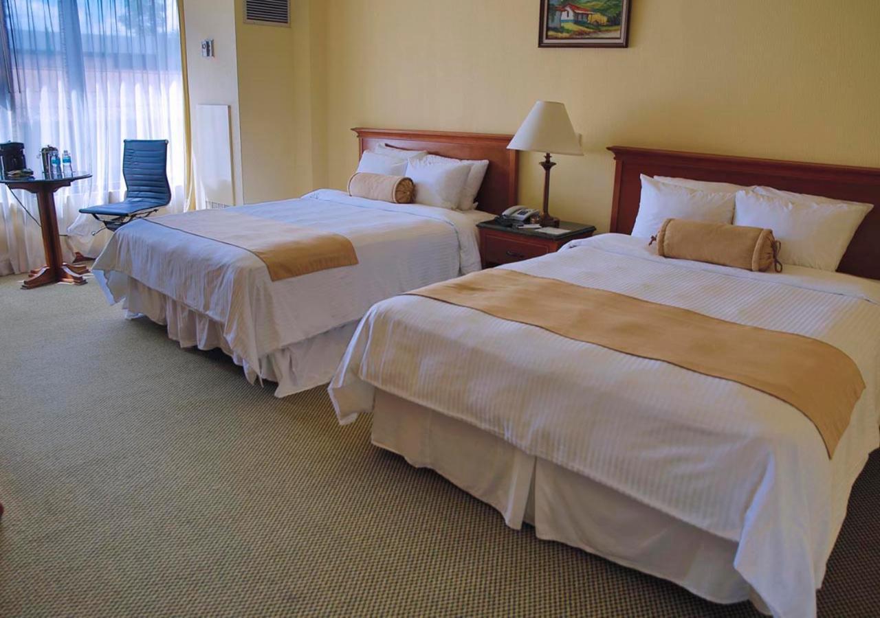 Wyndham San Jose Herradura Extérieur photo A room at the hotel